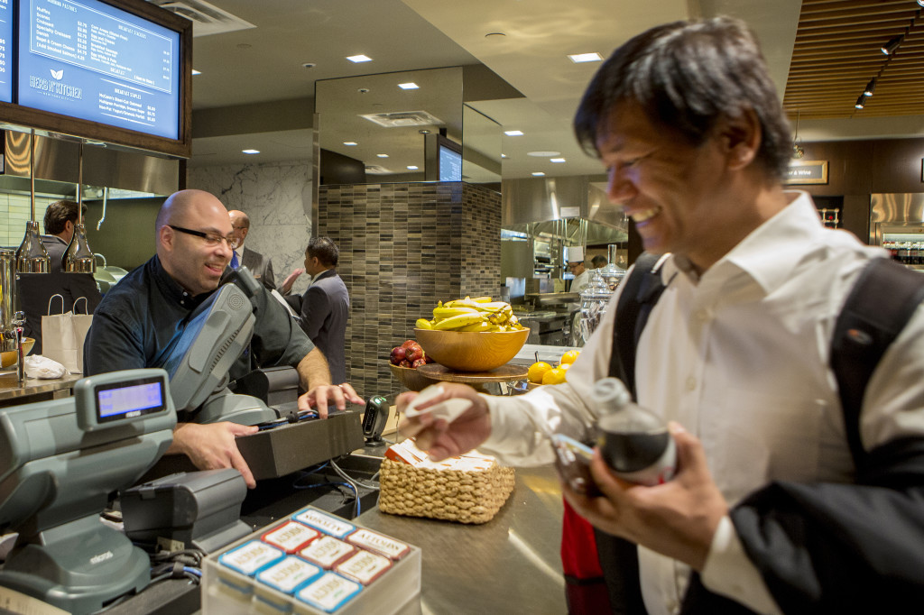 Washington, D.C., AAJA member Bobby Calvan grabs a snack at the food shop in the Hilton. FRANCES WANG | VOICES