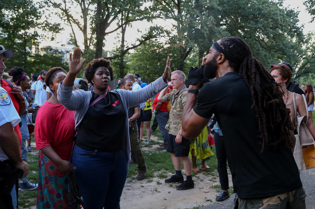 Two protesters argue during the National Moment of Silence for Michael Brown on Thursday, August 14, 2014 in Washington D.C. Protesters held a moment of silence for Michael Brown who was shot by police in Ferguson, Missouri. Brown was unarmed and had his hands up at the time he was shot. Photo credit: Brian Nguyen