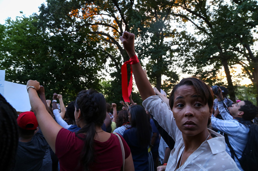 Protesters held up their fists in a sign of solidarity during the National Moment of Silence for Michael Brown on Thursday, August 14, 2014 in Washington D.C. Protesters held a moment of silence for Michael Brown who was shot by police in Ferguson, Missouri. Brown was unarmed and had his hands up at the time he was shot. Photo credit: Brian Nguyen
