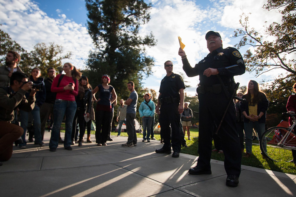 Officer Raymond Sutera presents the UC Davis policy against overnight camping to the Occupy UC Davis general assembly on November 18, 2011 Davis, Calif. (BRIAN NGUYEN/THE CALIFORNIA AGGIE)