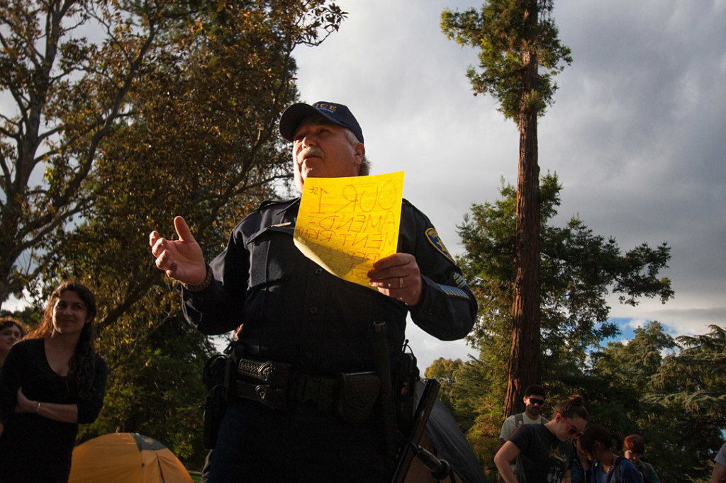 Officer Raymond Sutera presents the UC Davis policy against overnight camping to the Occupy UC Davis general assembly on November 18, 2011 Davis, Calif. (BRIAN NGUYEN/THE CALIFORNIA AGGIE)