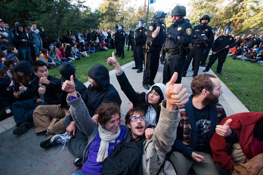 Students hold an impromptu general assembly during the police raid on the Occupy UC Davis encampment, voting the police off the quad on November 18, 2011 Davis, Calif. Shortly after, Lt. John Pike pepper sprayed the line of students (BRIAN NGUYEN/THE CALIFORNIA AGGIE)