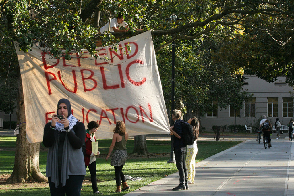 Students hang up a sign on November 18, 2011 Davis, Calif. Shortly after, Lt. John Pike pepper sprayed the line of students (BRIAN NGUYEN/THE CALIFORNIA AGGIE)