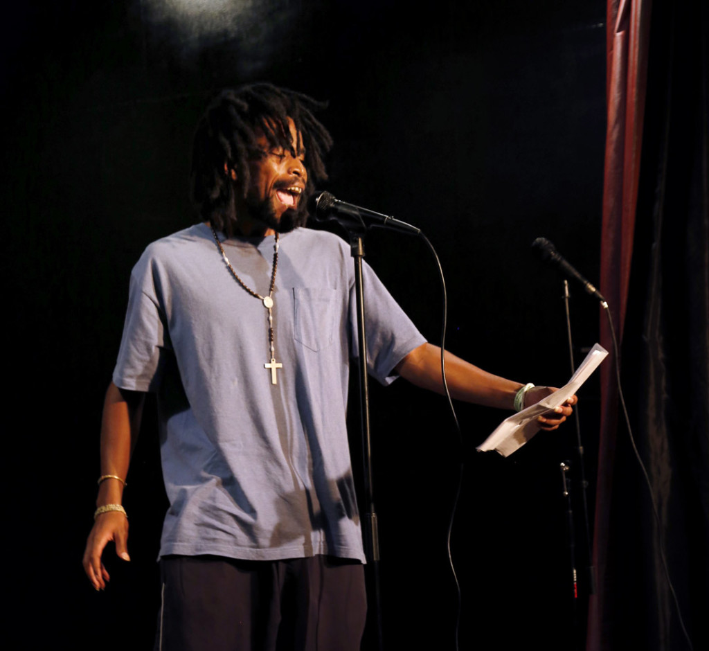 A performer recites a poem at the Open Mic night at BusBoys and Poets restaurant in Washington DC on Wednesday, August 13, 2014. (Sadia Khatri/AAJA VOICES)