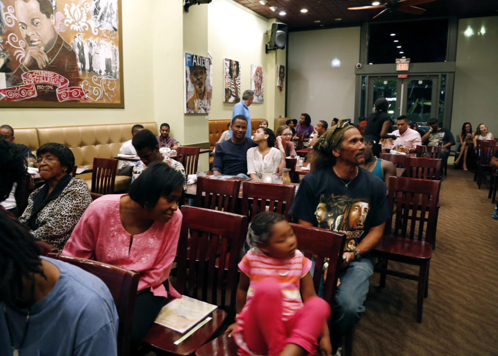 The audience waits for the weekly Open Mic night to begin at Busboys and Poets restaurant on Wednesday at 5th and K Street in Washington DC on Wednesday, August 13, 2014. (Sadia Khatri/AAJA VOICES)
