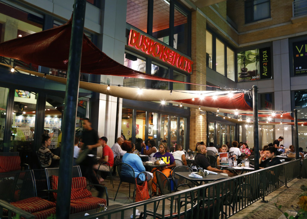A crowd outside Busboys and Poets enjoys their patio space along K Street in Washington DC on Wednesday, August 13, 2014. (Sadia Khatri/AAJA VOICES)
